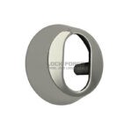 Ümmargune südamikukate poleeritud roostevabast terasest. Keskel ovaalne ava.